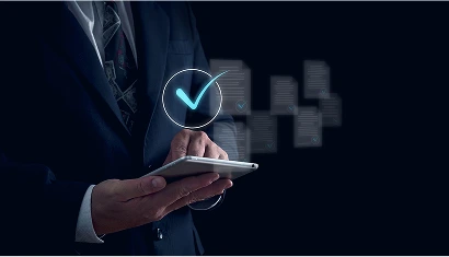 A man in a suit holding a tablet