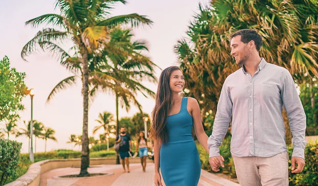 Married couple walking together after their green card approval