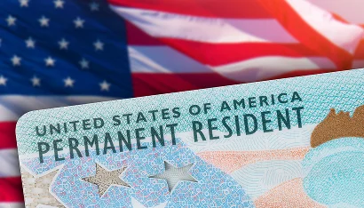 Permanent resident card against the Stars and Stripes